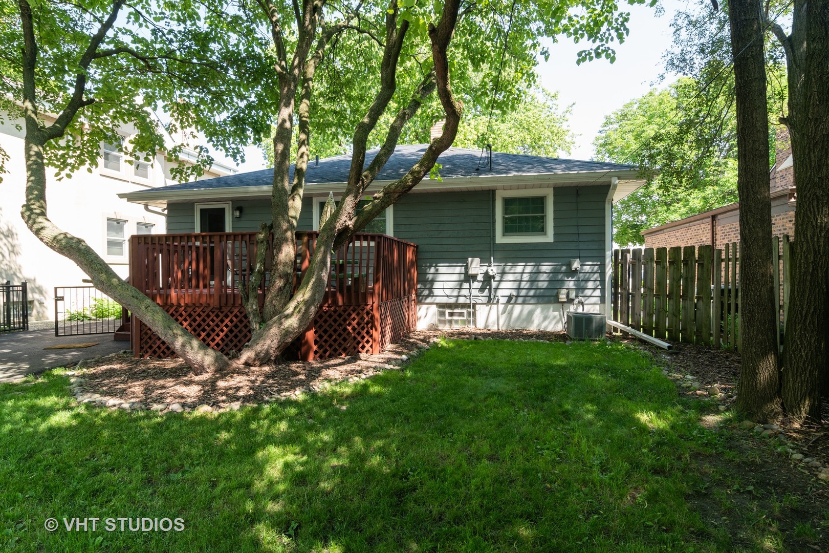 137 East Quincy Street Riverside, IL 60546 - Photo 10 of 14 a view of a backyard with a small cabin