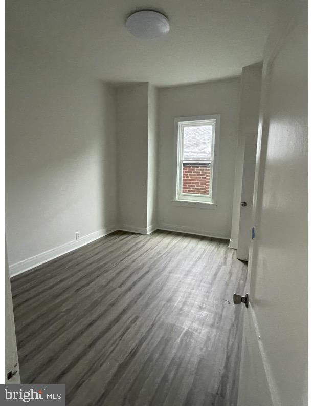 119 East Main Street, Unit 2 Middletown, PA 17057 - Photo 3 of 4 wooden floor in an empty room with a window