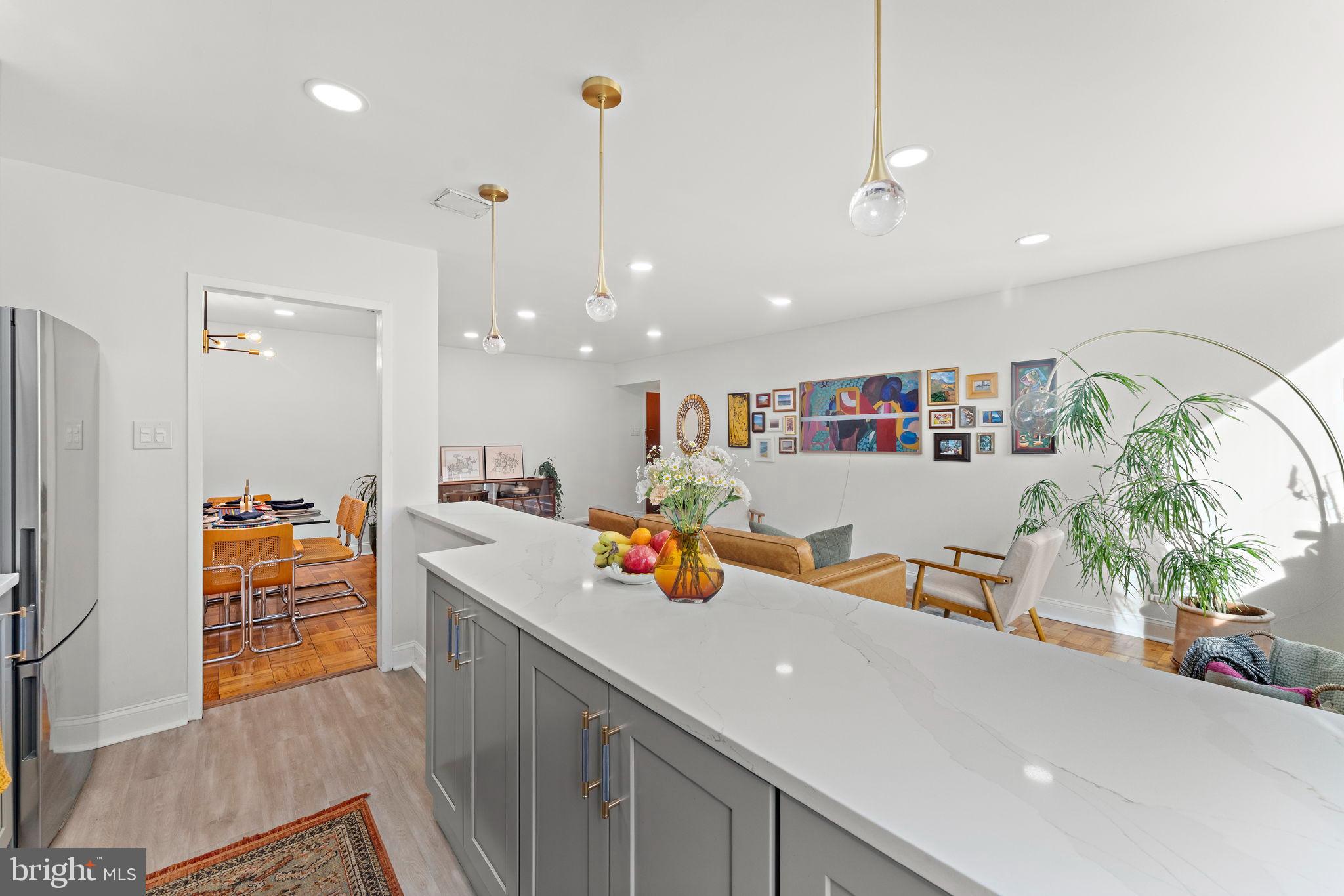 4200 Cathedral Avenue Northwest, Unit 610 Washington, DC 20016 - Photo 12 of 22 a kitchen with stainless steel appliances granite countertop a sink and a refrigerator