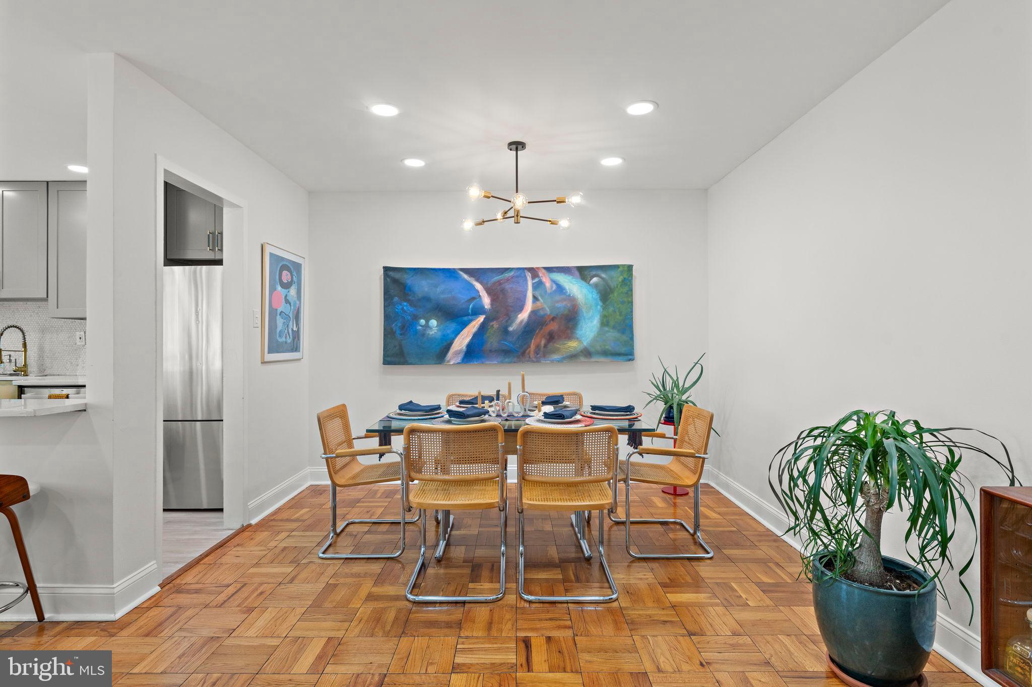 4200 Cathedral Avenue Northwest, Unit 610 Washington, DC 20016 - Photo 14 of 22 a view of a dining room with furniture and chandelier