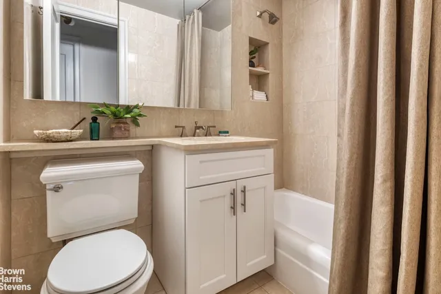 a bedroom with a large bed and a large window