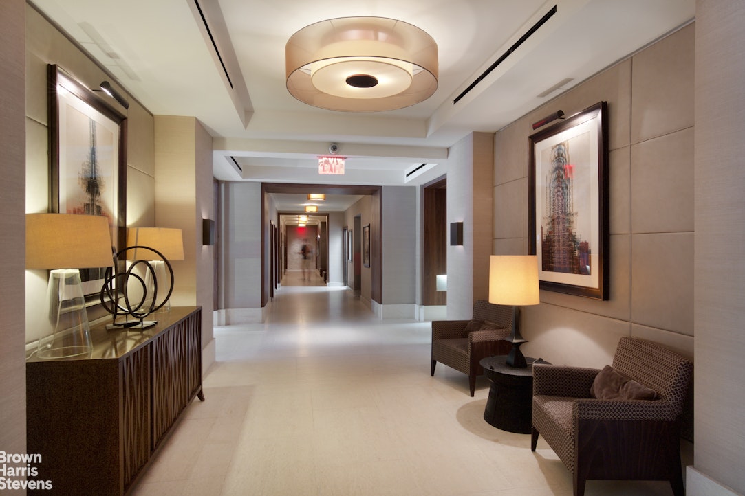 155 West 68th Street, Unit 28E Manhattan, NY 10023 - Photo 12 of 19 a lobby with furniture and window