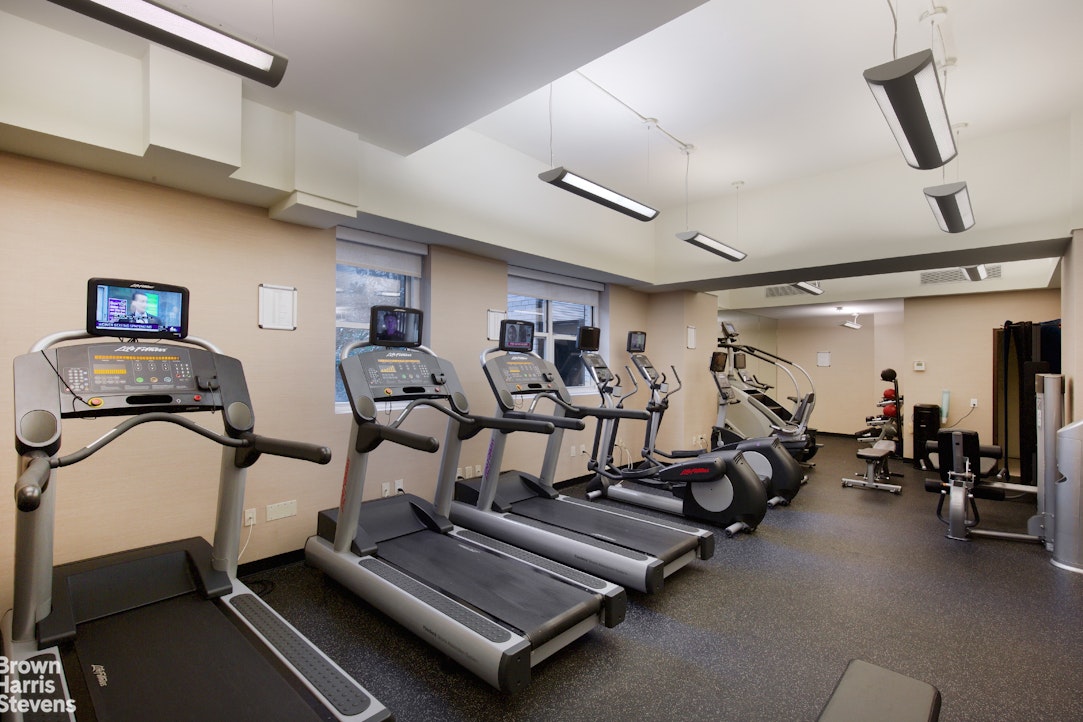155 West 68th Street, Unit 28E Manhattan, NY 10023 - Photo 15 of 19 a view of a room with gym equipment