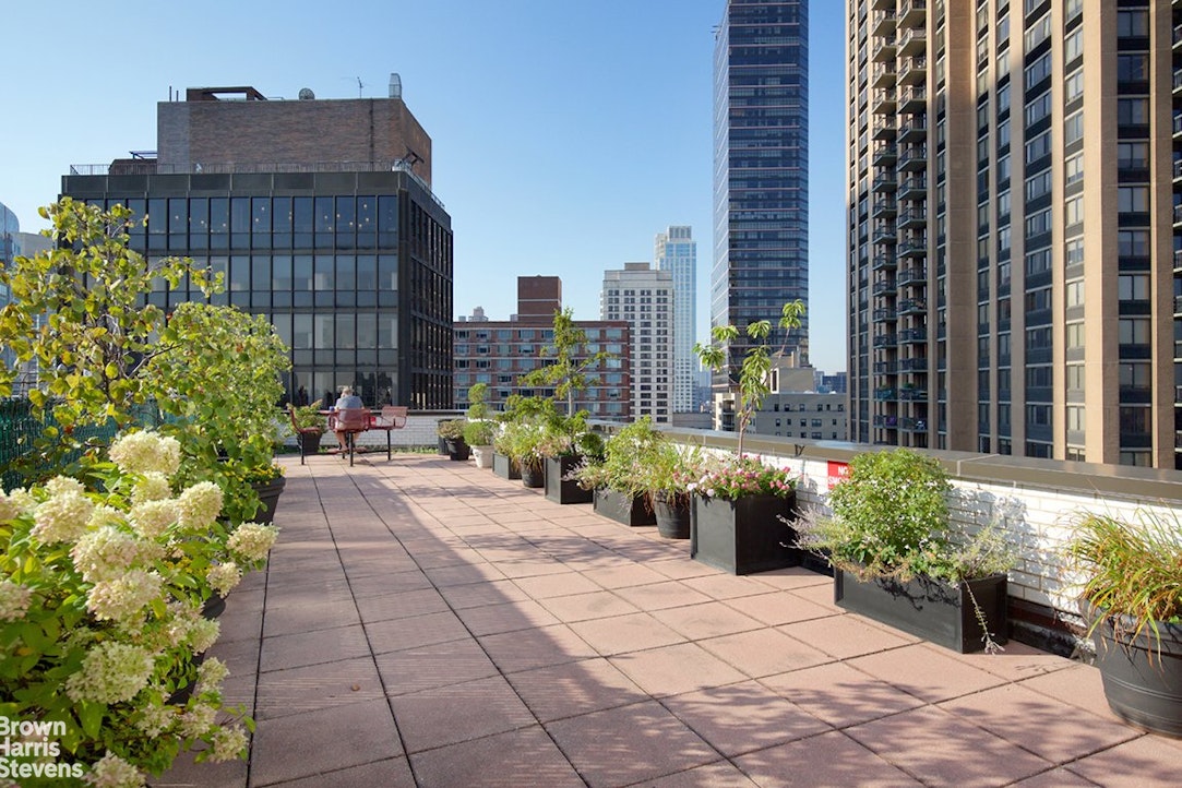 155 West 68th Street, Unit 28E Manhattan, NY 10023 - Photo 16 of 19 a view of a building with potted plants