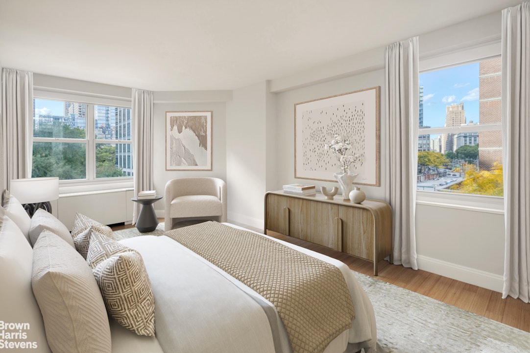 155 West 68th Street, Unit 28E Manhattan, NY 10023 - Photo 5 of 19 a bedroom with two beds and a large window