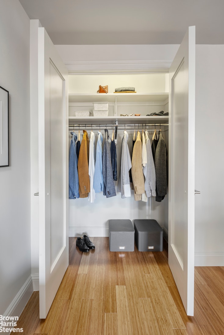 155 West 68th Street, Unit 28E Manhattan, NY 10023 - Photo 7 of 19 a view of walk in closet with clothes and shoes