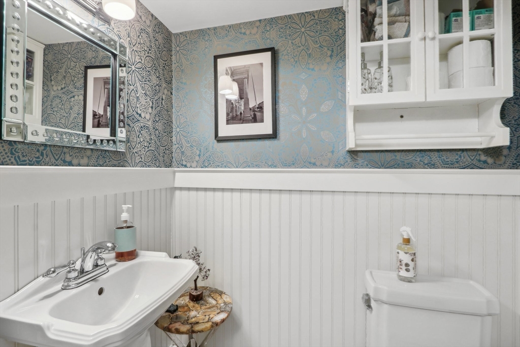 308 Prince Street Newton, MA 02465 - Photo 17 of 40 a bathroom with a sink and a mirror