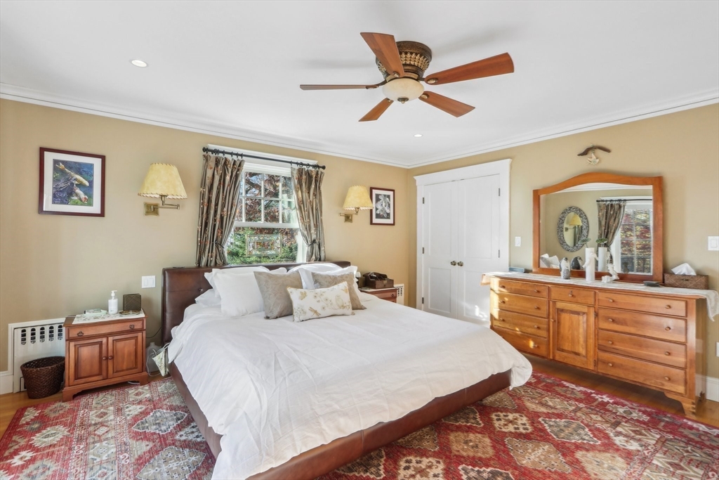 308 Prince Street Newton, MA 02465 - Photo 19 of 40 a bedroom with a bed and a dresser