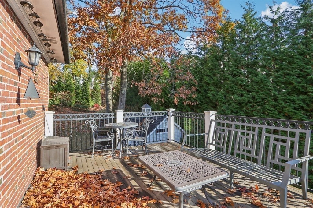 308 Prince Street Newton, MA 02465 - Photo 20 of 40 a view of a patio with a table and chairs