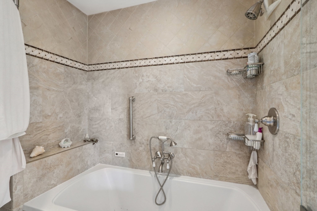 308 Prince Street Newton, MA 02465 - Photo 22 of 40 a bathroom with a shower and a bath tub