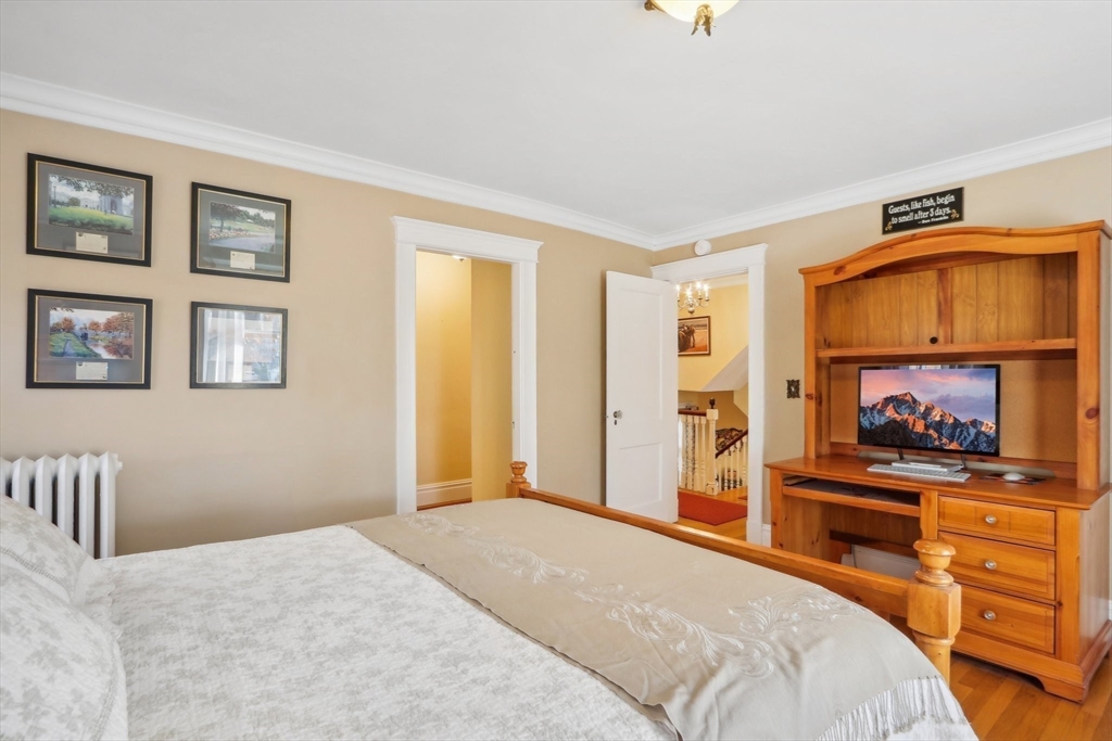 308 Prince Street Newton, MA 02465 - Photo 24 of 40 a bedroom with a bed and a cabinets