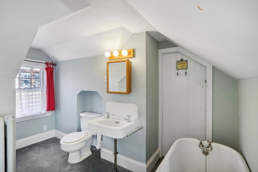 308 Prince Street Newton, MA 02465 - Photo 28 of 40 a bathroom with a sink toilet and a mirror