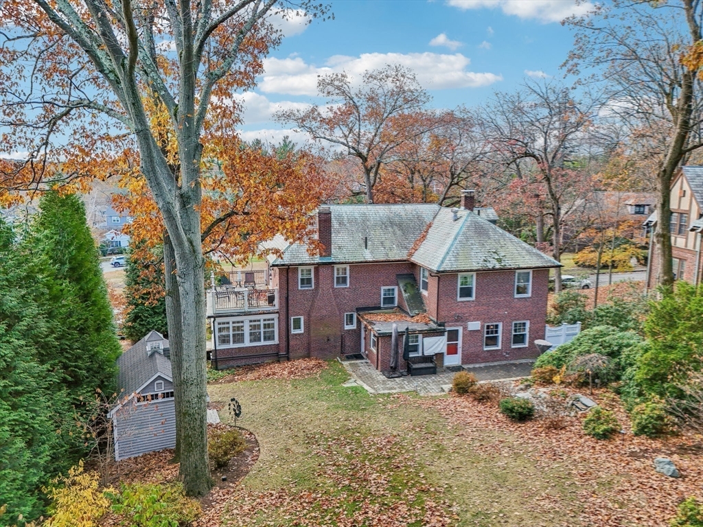 308 Prince Street Newton, MA 02465 - Photo 29 of 40 a front view of a house with a yard covered with snow in the yard