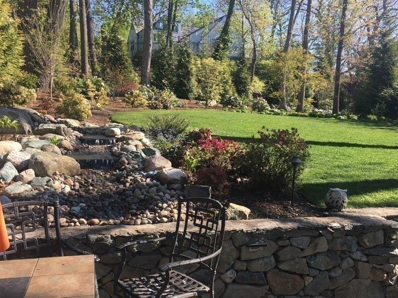 308 Prince Street Newton, MA 02465 - Photo 32 of 40 a view of a garden with a bench