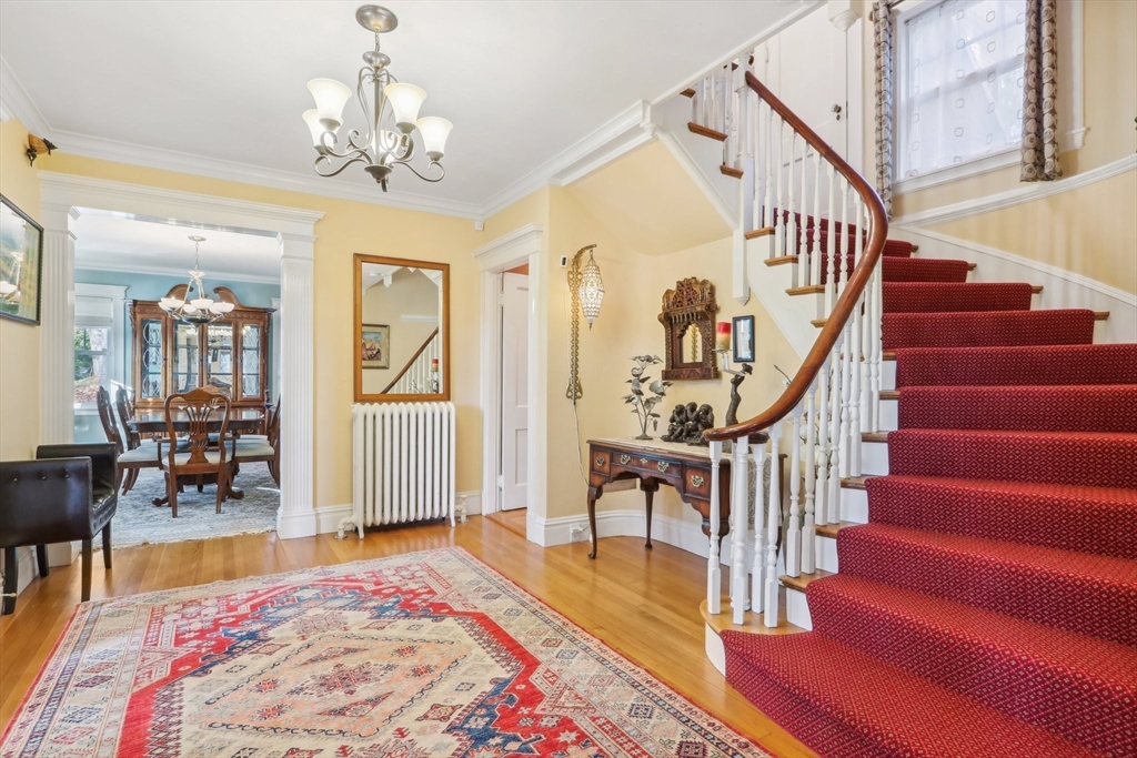 308 Prince Street Newton, MA 02465 - Photo 4 of 40 a view of staircase with furniture and rug