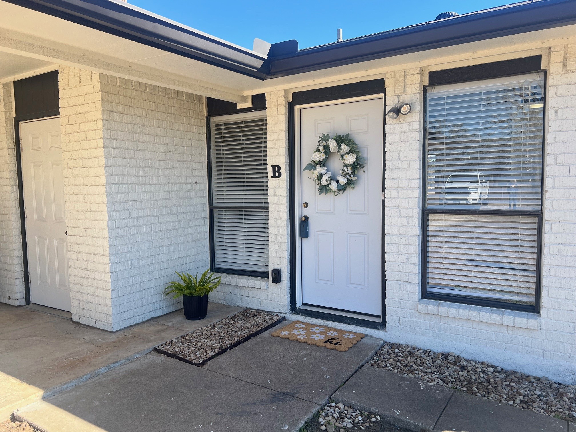 Side B Entrance to property with brick siding