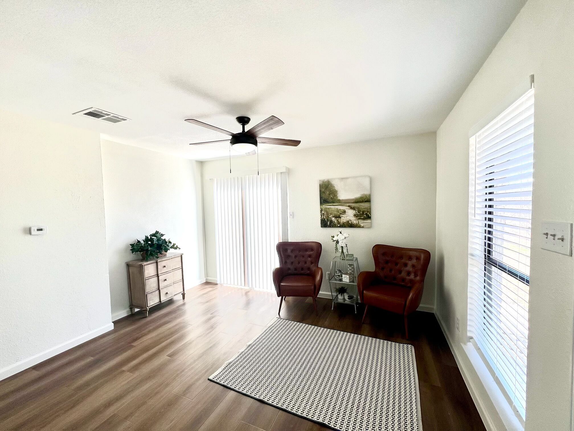 245 Mt Olive Road, Unit A & B Cedar Creek, TX 78612 - Photo 10 of 33 Living area with dark wood-type flooring, ceiling fan, and plenty of natural light