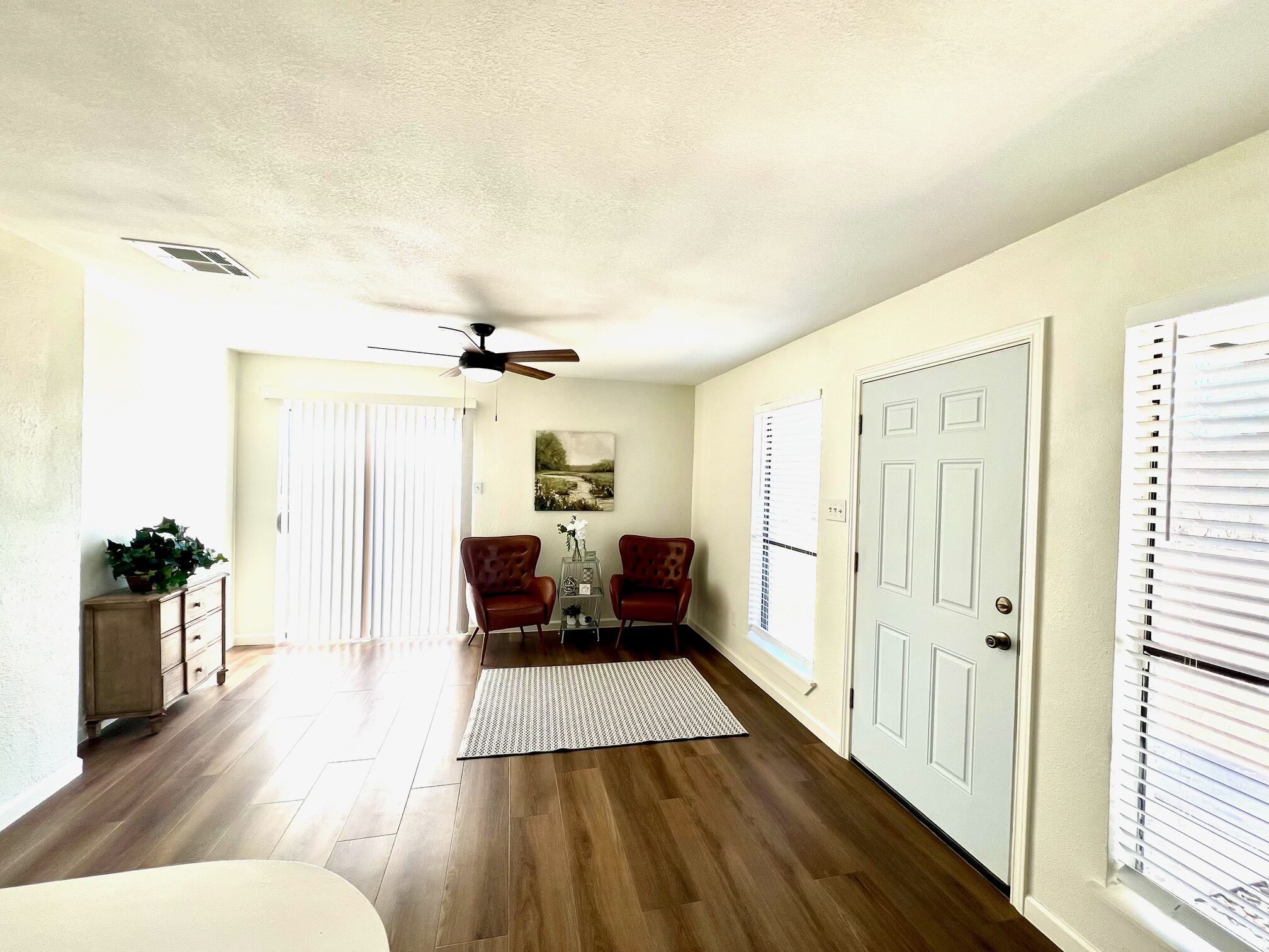 245 Mt Olive Road, Unit A & B Cedar Creek, TX 78612 - Photo 11 of 33 Foyer featuring dark wood-style flooring, a textured ceiling, and a ceiling fan