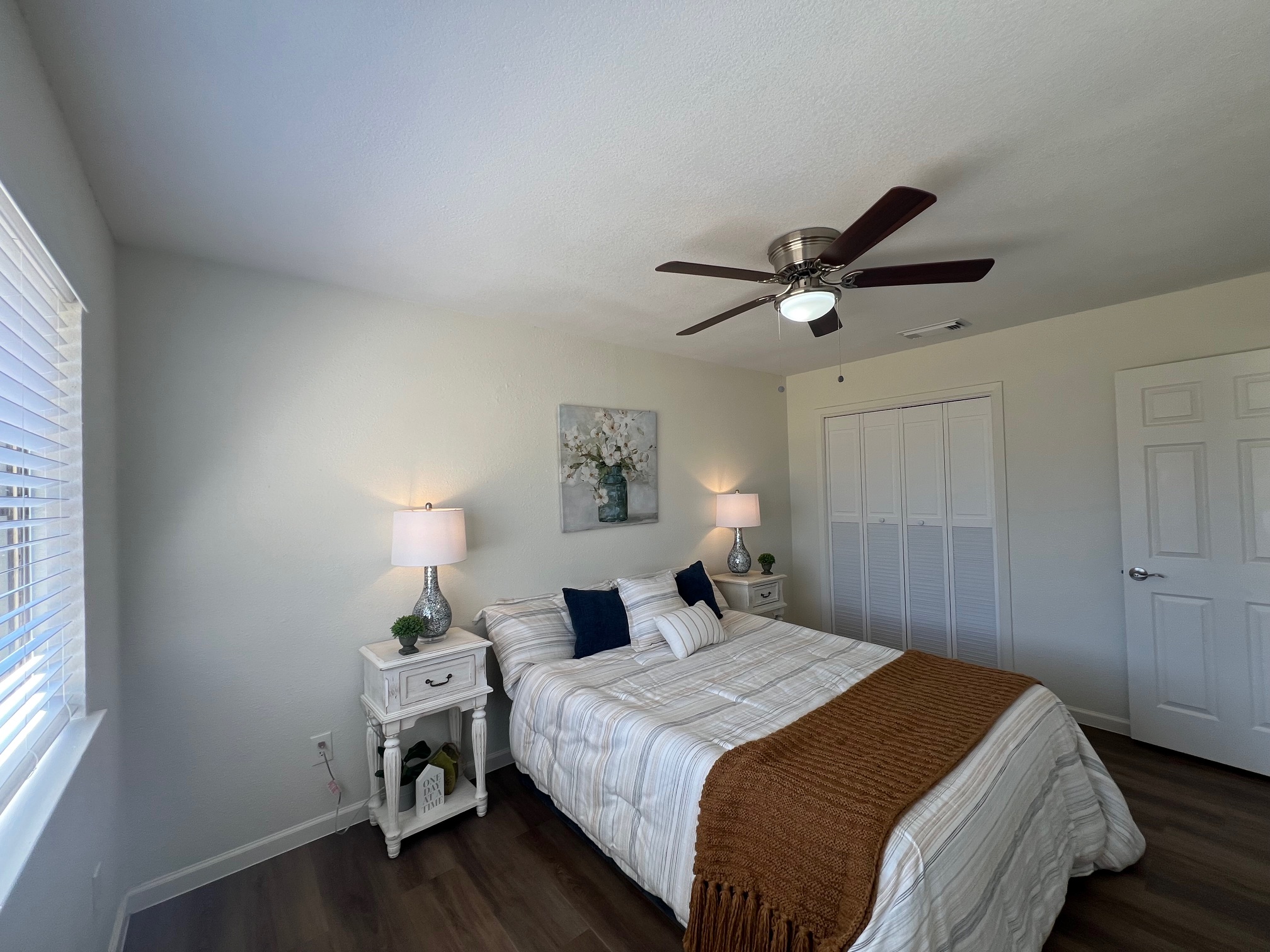 245 Mt Olive Road, Unit A & B Cedar Creek, TX 78612 - Photo 14 of 33 Unit B Bedroom featuring dark wood-style tile flooring, a ceiling fan, and a closet