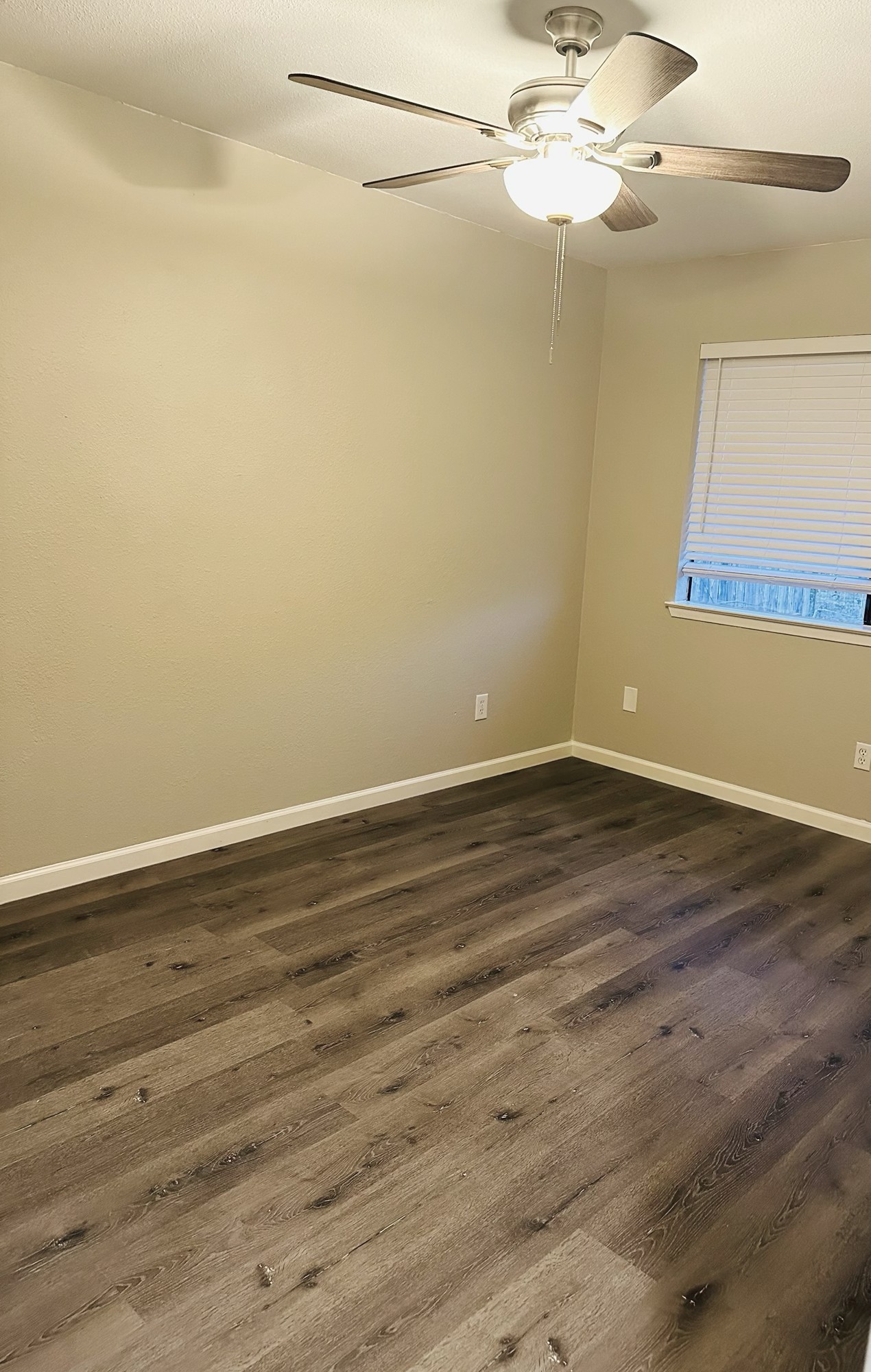 245 Mt Olive Road, Unit A & B Cedar Creek, TX 78612 - Photo 23 of 33 Unit A Bedroom featuring a ceiling fan and dark wood style flooring
