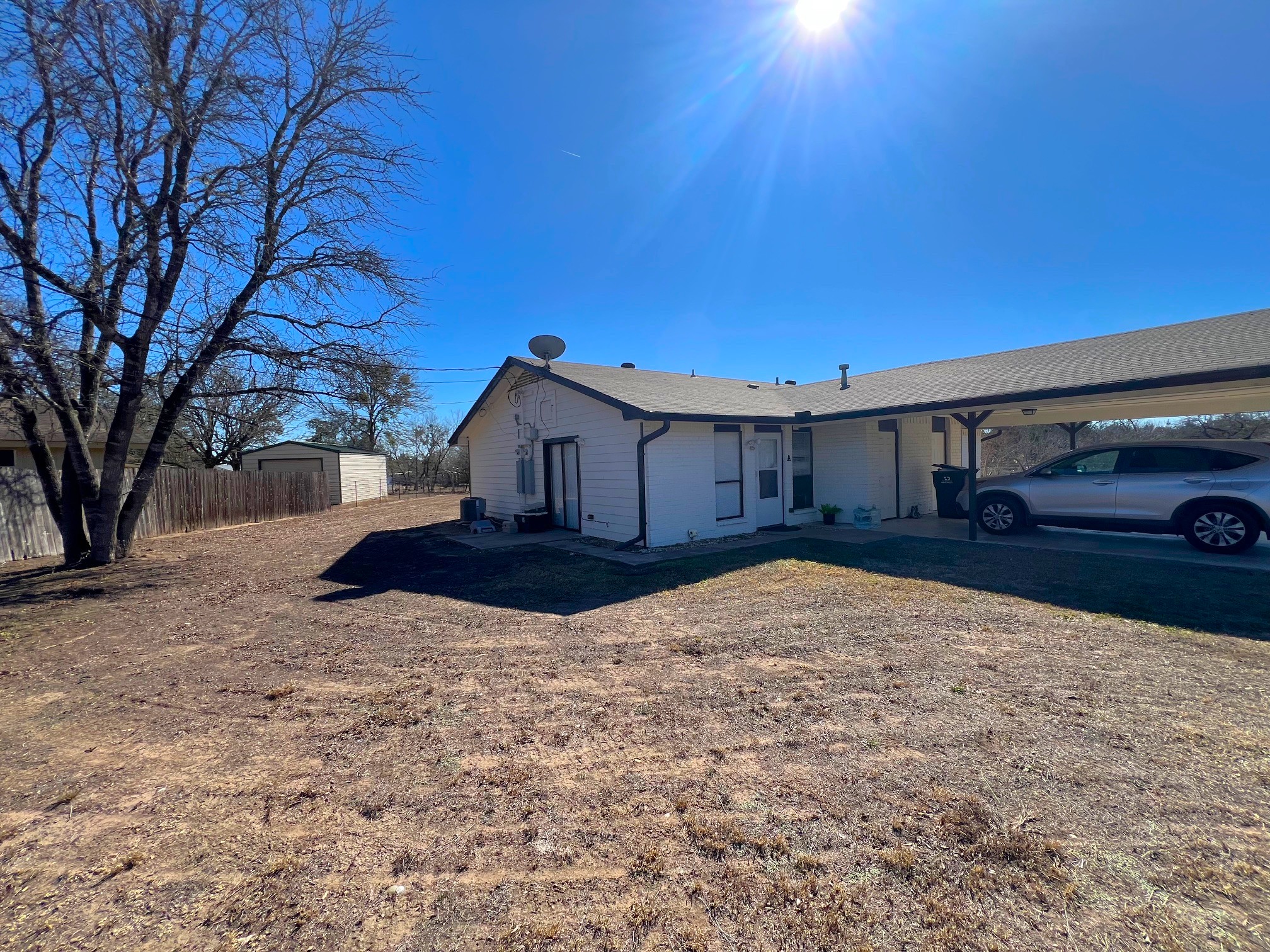 245 Mt Olive Road, Unit A & B Cedar Creek, TX 78612 - Photo 26 of 33 Exterior Unit A featuring carport Laundry room and side patio area