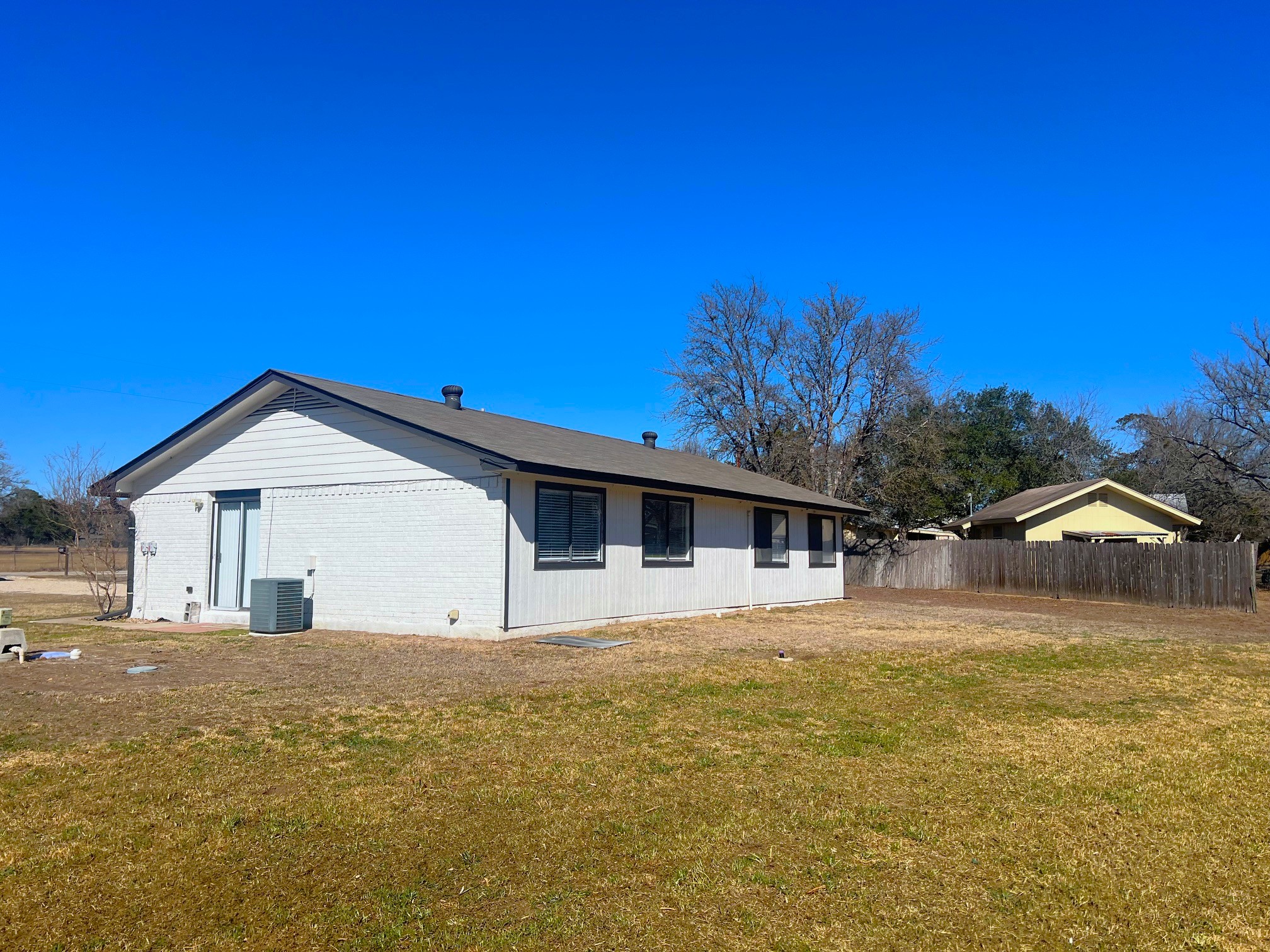 245 Mt Olive Road, Unit A & B Cedar Creek, TX 78612 - Photo 29 of 33 Back of Duplex with brick siding and large yard