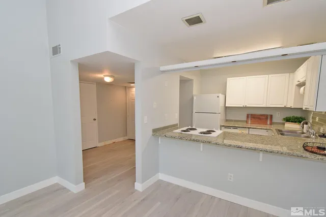 a room with a sink and a mirror