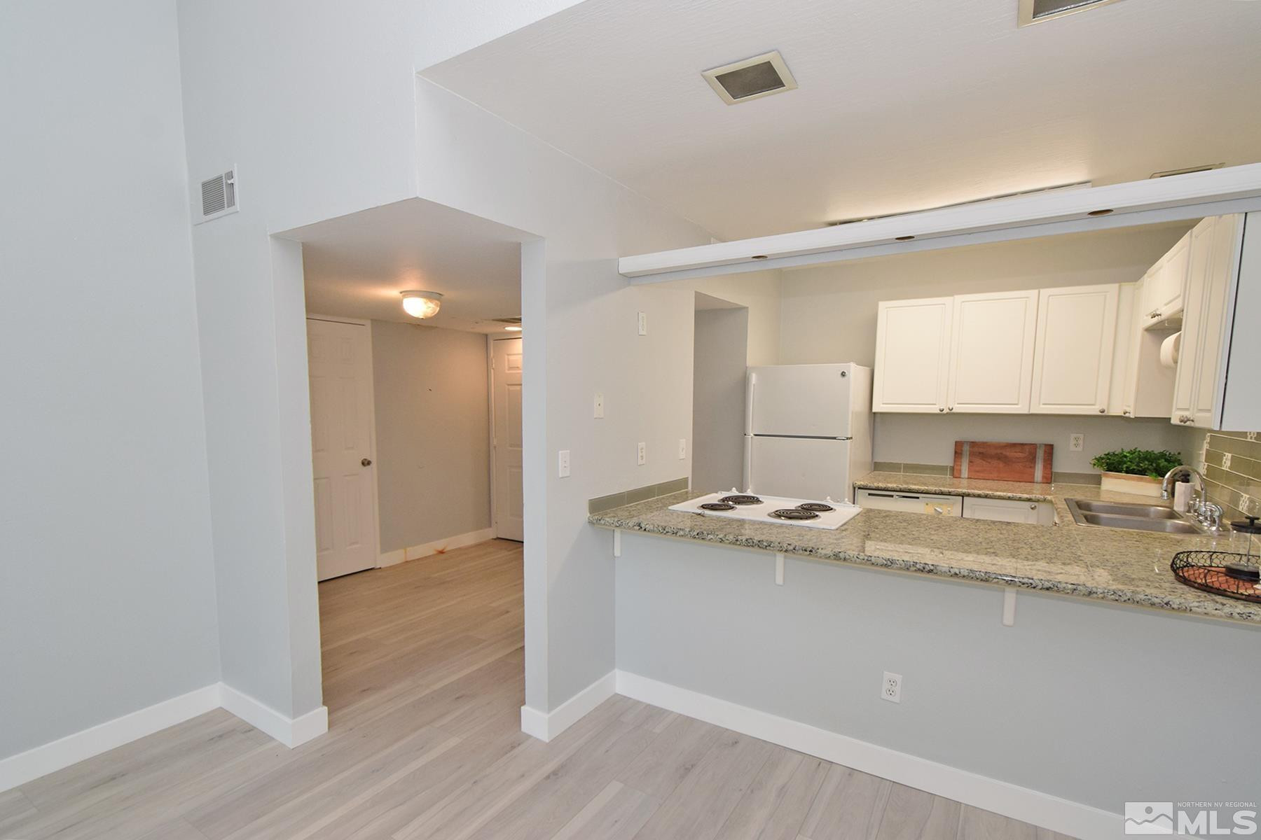 a room with a sink and a mirror