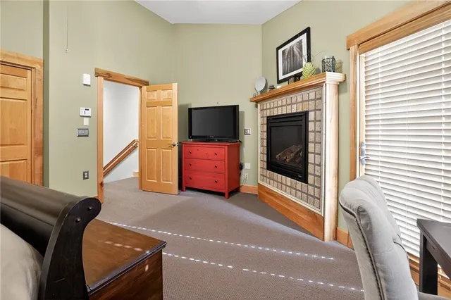 a living room with furniture flat screen tv and a fireplace