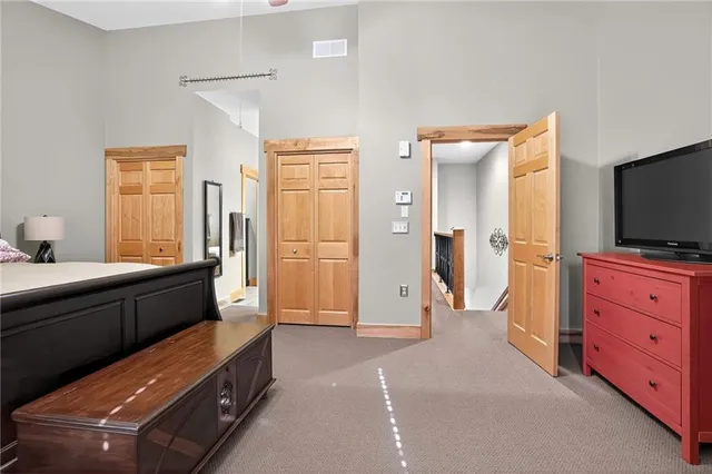 a room with furniture and a flat tv screen on dresser