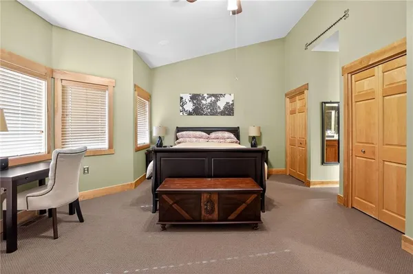 a bedroom with bed and a window