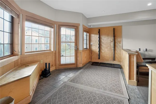 a view of a bedroom with furniture and windows