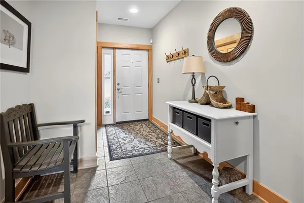 a bedroom with bed and a chair