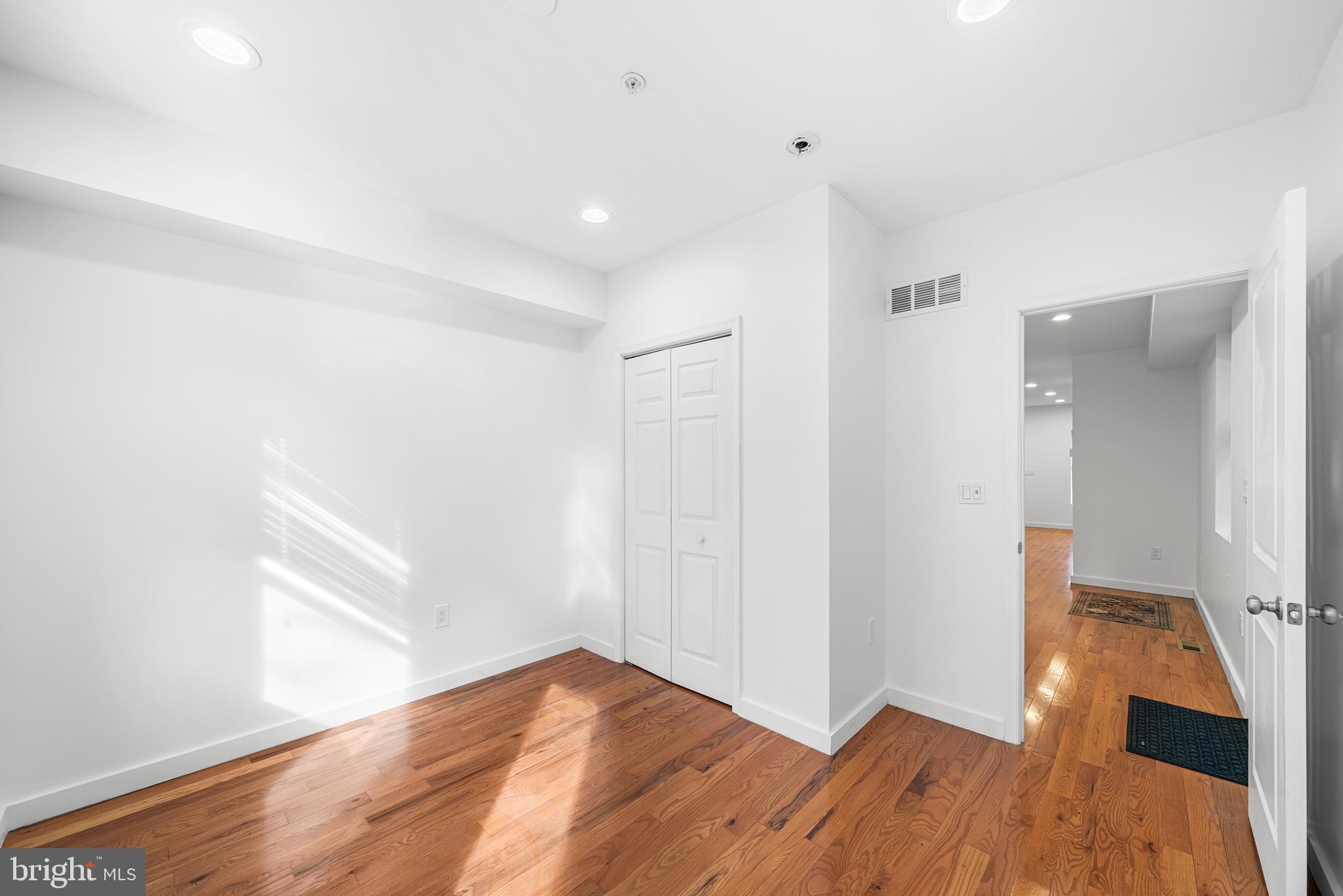 1346 South 46th Street Philadelphia, PA 19143 - Photo 13 of 32 a view of hallway with wooden floor