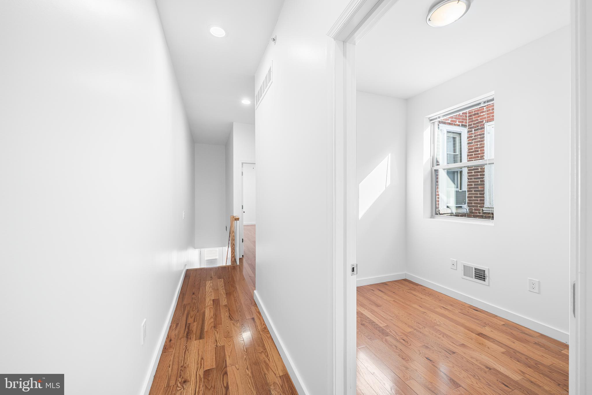 1346 South 46th Street Philadelphia, PA 19143 - Photo 19 of 32 a view of a hallway with wooden floor and closet