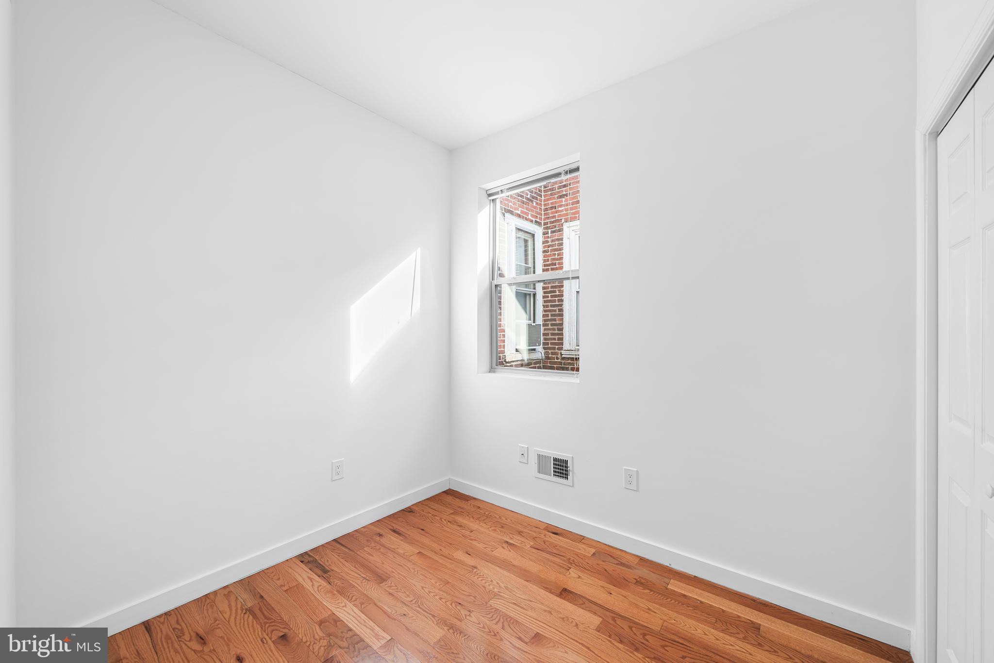 1346 South 46th Street Philadelphia, PA 19143 - Photo 20 of 32 a view of a room with wooden floor and white walls
