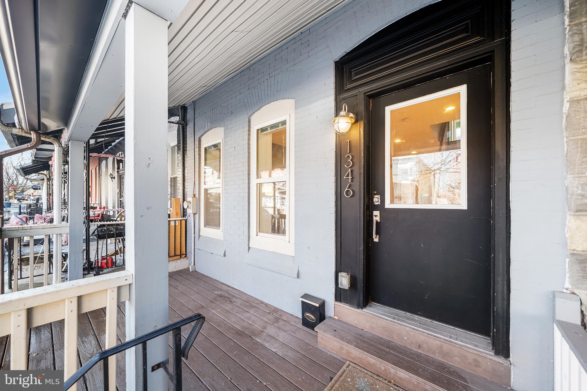 1346 South 46th Street Philadelphia, PA 19143 - Photo 2 of 32 a view of a hallway with wooden floor and staircase