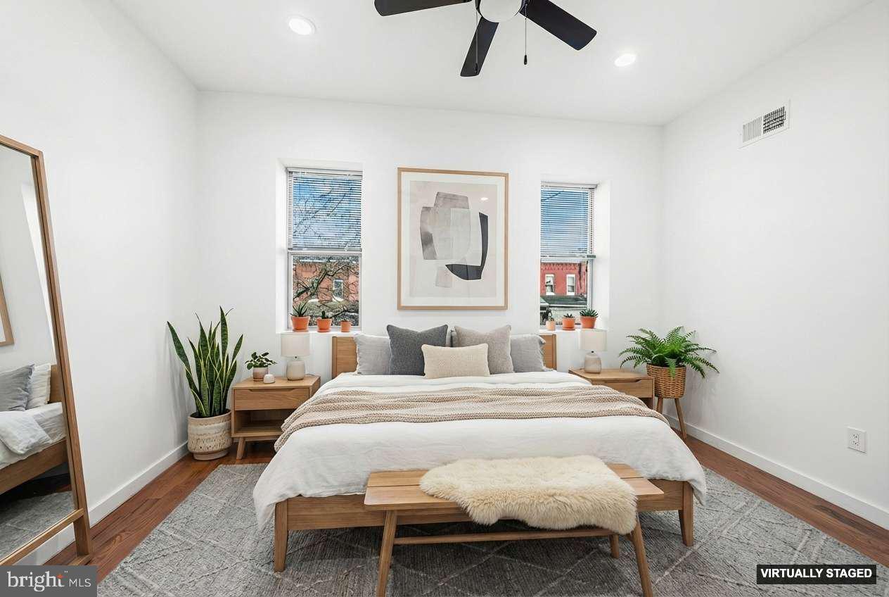 1346 South 46th Street Philadelphia, PA 19143 - Photo 23 of 32 a bedroom with a bed and ceiling fan
