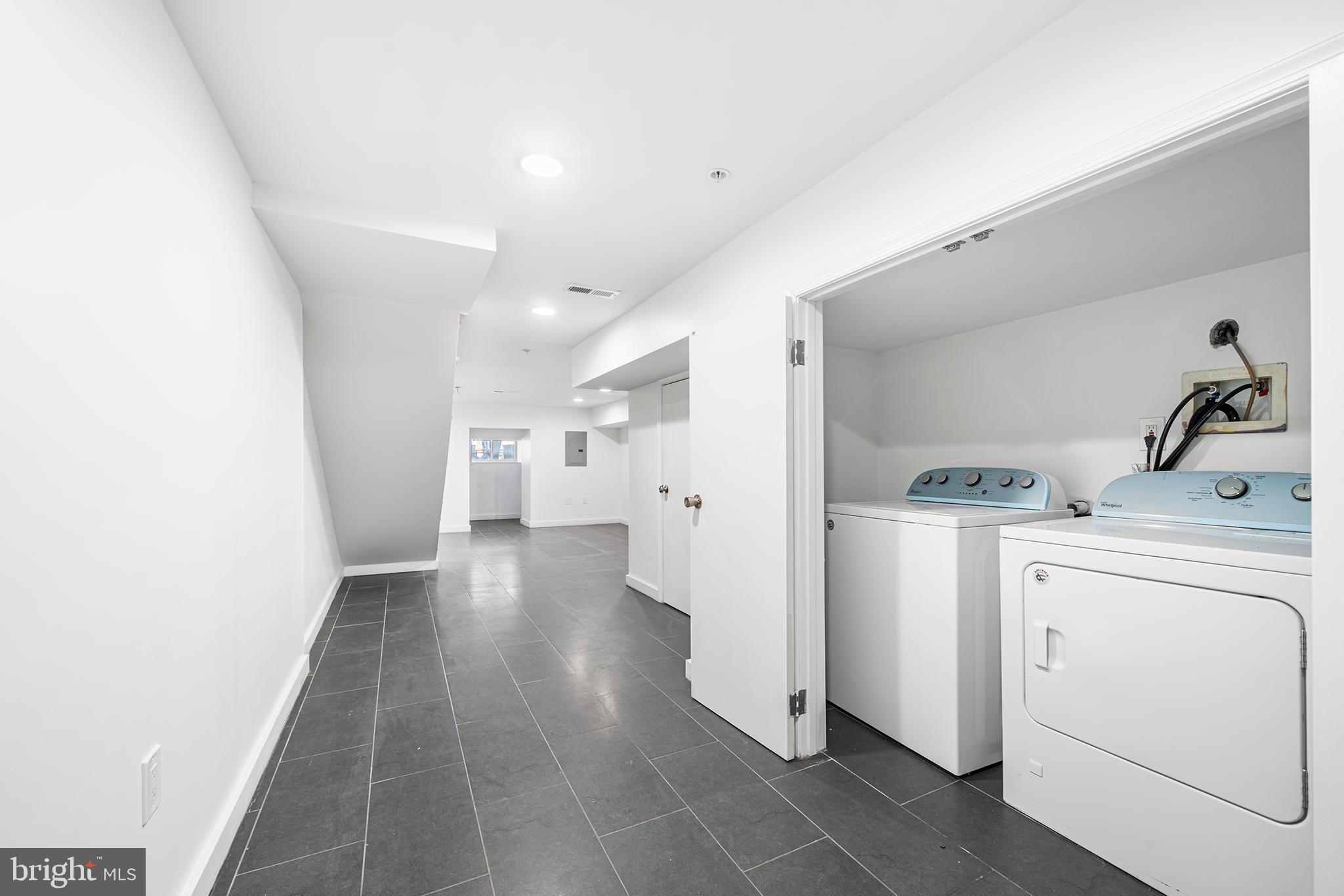 1346 South 46th Street Philadelphia, PA 19143 - Photo 29 of 32 a view of a storage & utility room with washer and dryer
