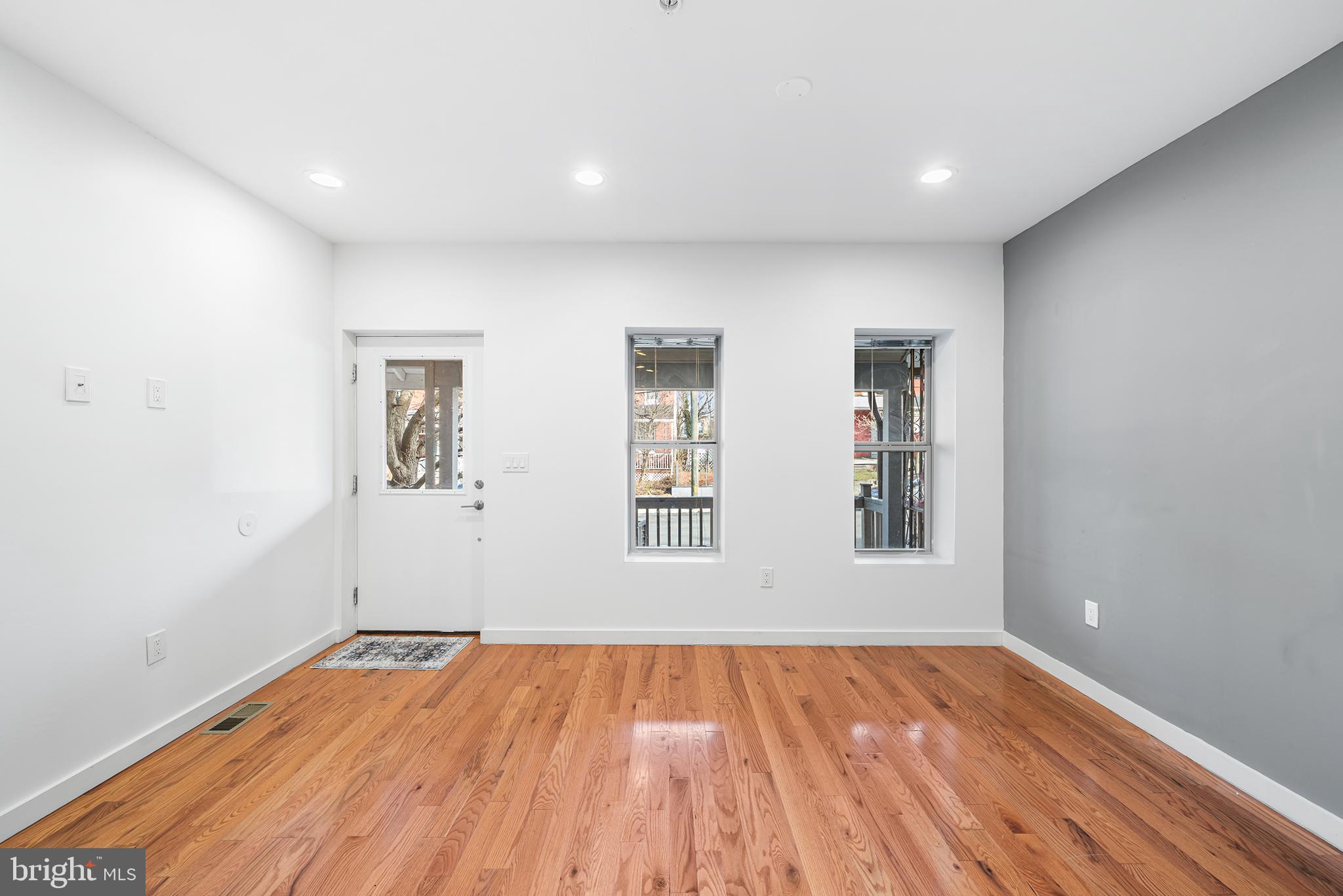 1346 South 46th Street Philadelphia, PA 19143 - Photo 5 of 32 a view of empty room with wooden floor and fan