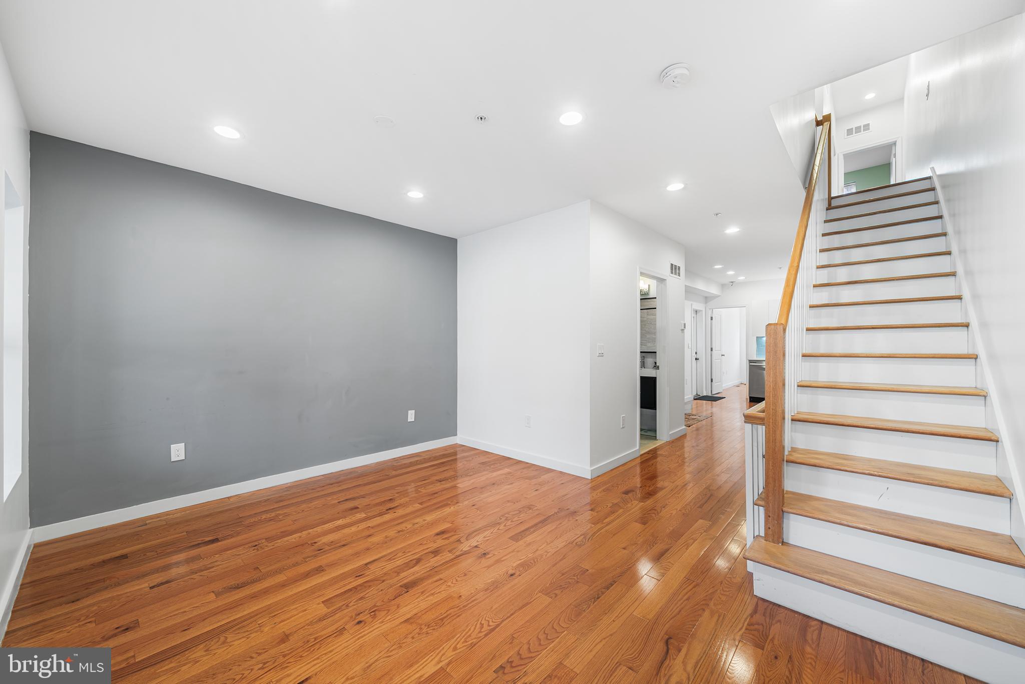 1346 South 46th Street Philadelphia, PA 19143 - Photo 7 of 32 a view of a hallway with wooden floor and staircase
