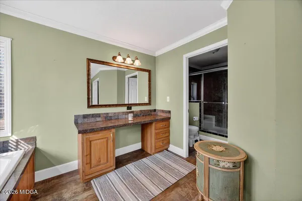 a room with a sink and a mirror