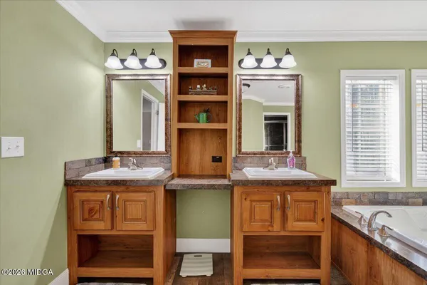 a bathroom with a sink and a large mirror