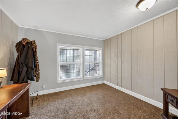 a view of a room with window and a wooden floor