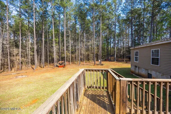 a view of swimming pool with a patio