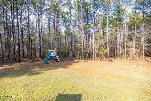 a view of a park with swings and slides