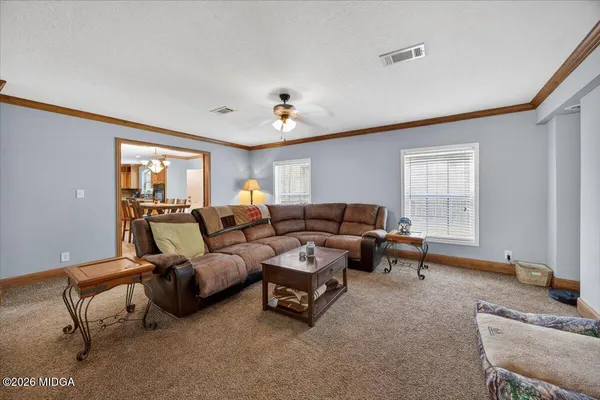 a living room with furniture and a window