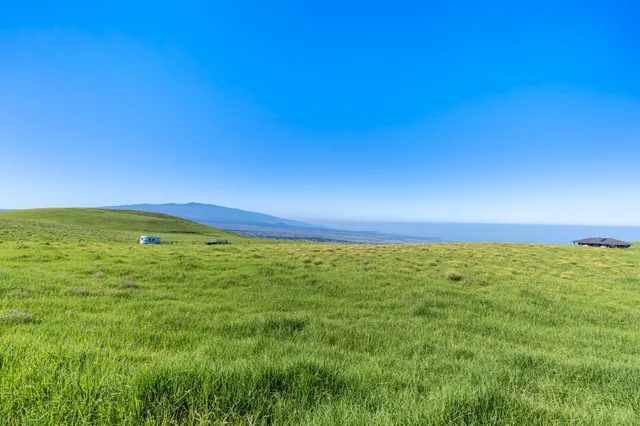 a view of an ocean and a mountain