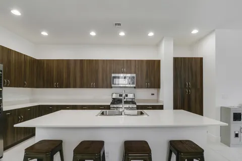 a bedroom with a bed and dresser