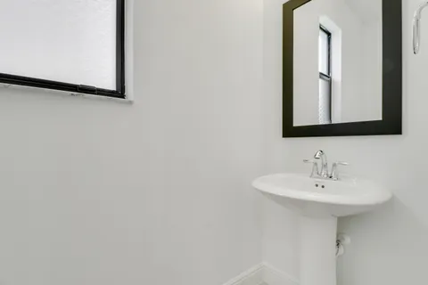 a bathroom with a glass shower door